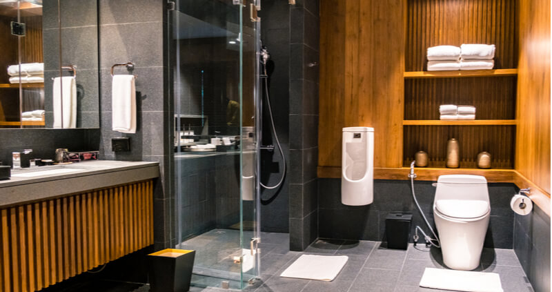 Japanese Inspired Wetroom with Wood Panelling and black stone tiles