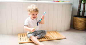 child playing on a bathmat