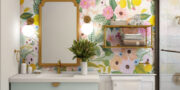 Wetroom with art, mirror shelf with towels, and lovely colourful wallpaper