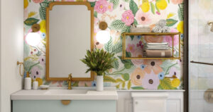 Wetroom with art, mirror shelf with towels, and lovely colourful wallpaper