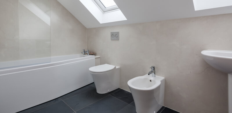 white bathroom set with sloped ceiling