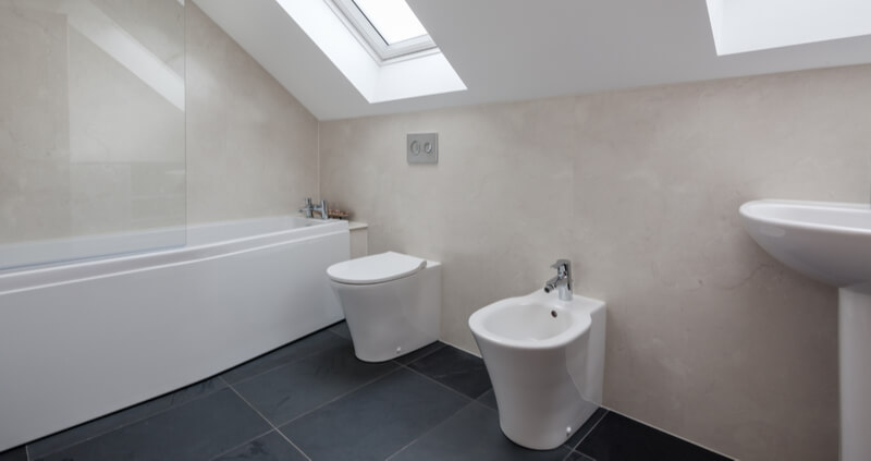 white bathroom set with sloped ceiling