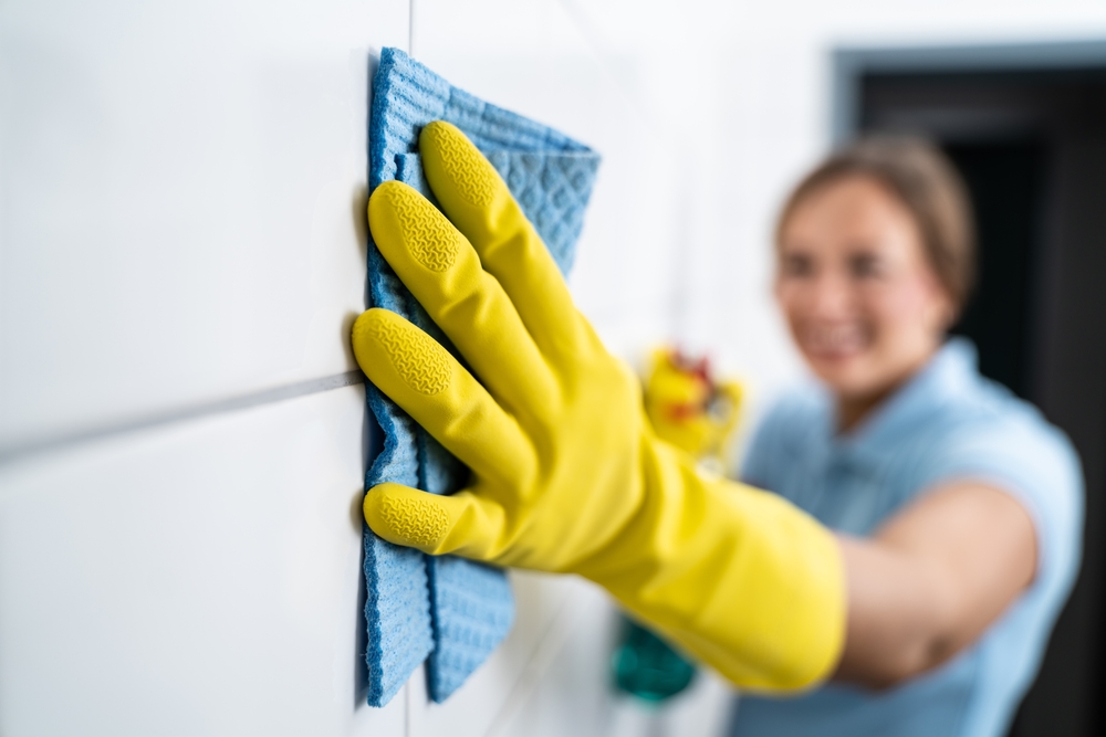 Grout tile cleaning. Cleaning wall with wipe